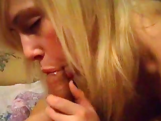 Pretty blonde is giving a blowjob